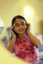 glasses on little girl with black hair and brown skin